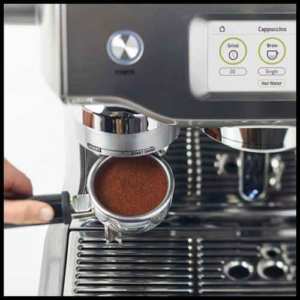integrated conical burr grinder automatically grinds, doses and tamps 22 grams